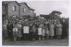 Presentation to-Mrs Winsmore-Hooper taken outside Village Hall